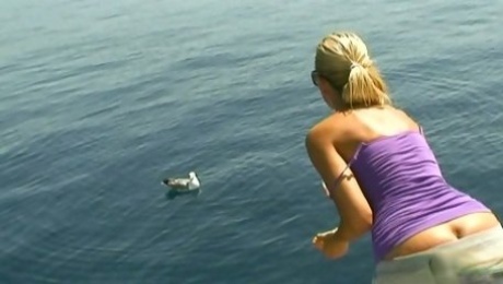 Obedient housewife Sandy takes a sun bath on the boat topless