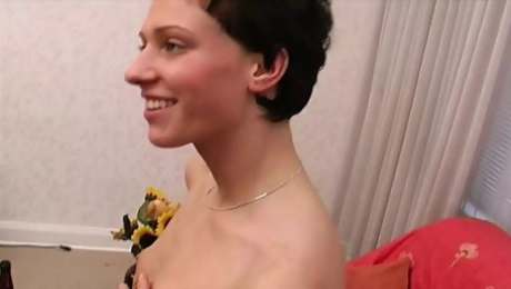 A slim German babe gets her small boobs sprayed with cum