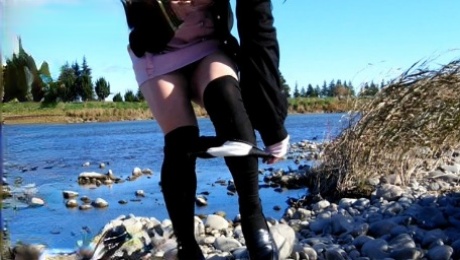 Cute crossdresser Honoka masturbated on the riverbank and peed herself.