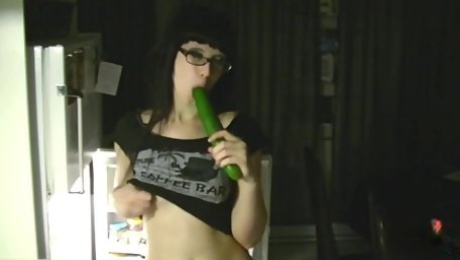 Black Haired Slut Shoves Cucumber Up Her Pussy